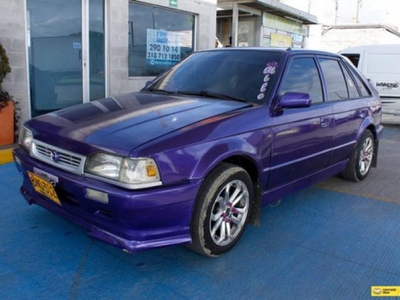 Mazda 323 1.3 Hs usado violeta 25.920 kilómetros $18.000.000